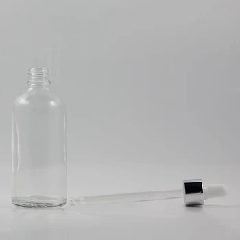 Geriausia pardavimo 100 ml skaidraus stiklo buteliuko lašintuvu odos priežiūros kosmetikos pakuotės su blizgiu sidabro užkratas